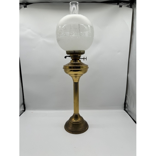 138 - Vintage Brass Parafin Column Lamp with acid etched design on glass globe - approximately 70cm