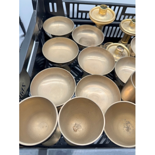 141 - Quantity of brass goblets / candle holders etc