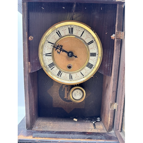 148 - 19th century Mantle clock by TH - 40cm x 15cm x 30cm - with key