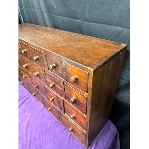 156 - Vintage Solid Teak Apothecary Cabinet of 22 drawers of graduating size 90.5cm x 25cm x 57cm