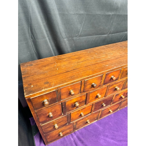 156 - Vintage Solid Teak Apothecary Cabinet of 22 drawers of graduating size 90.5cm x 25cm x 57cm