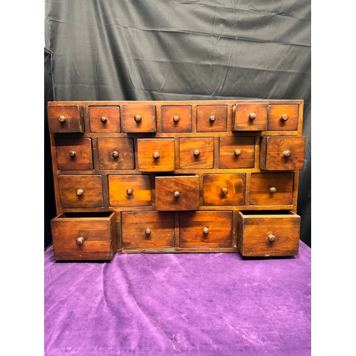 156 - Vintage Solid Teak Apothecary Cabinet of 22 drawers of graduating size 90.5cm x 25cm x 57cm