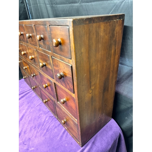 156 - Vintage Solid Teak Apothecary Cabinet of 22 drawers of graduating size 90.5cm x 25cm x 57cm