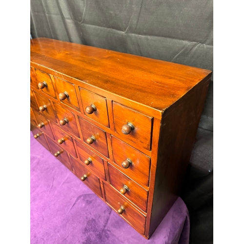 157 - Vintage Solid Teak Apothecary Cabinet of 22 drawers of graduating size 90.5cm x 25cm x 57cm