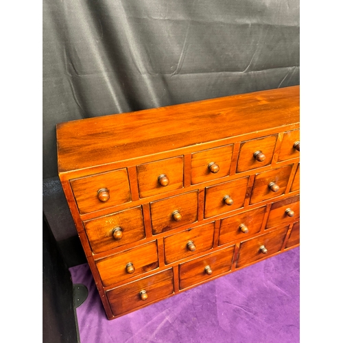 157 - Vintage Solid Teak Apothecary Cabinet of 22 drawers of graduating size 90.5cm x 25cm x 57cm