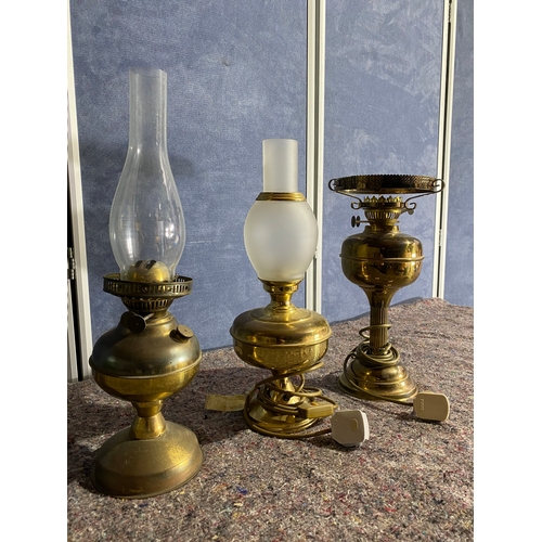 473 - A trio of Brass oil burner style lamps. (Two Electric)