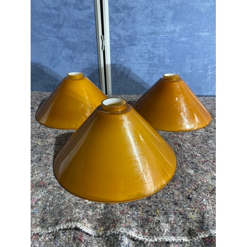 479 - A trio of vintage mustard yellow cased glass cone shaped Lamp shades.