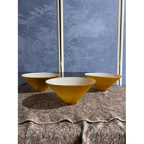 479 - A trio of vintage mustard yellow cased glass cone shaped Lamp shades.