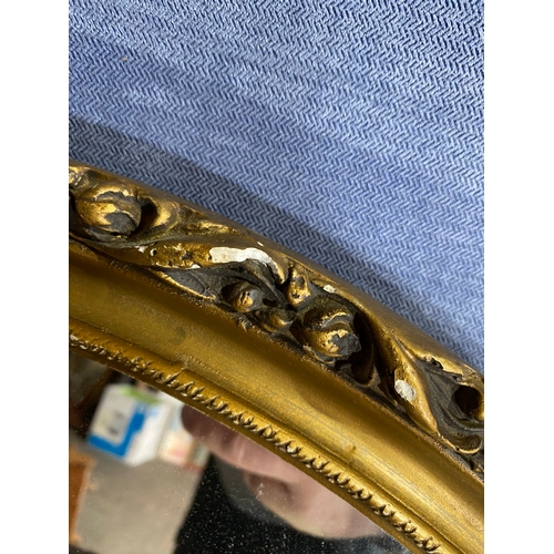 569 - Oval gilt framed mirror. 

Dimensions - 22.5