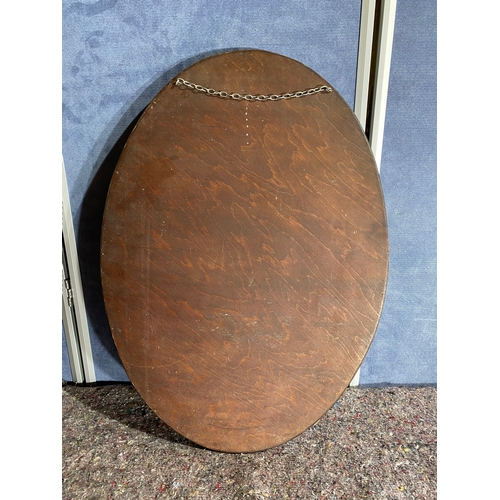 570 - Oval Wooden framed bevelled edge mirror. 

Dimensions - 28