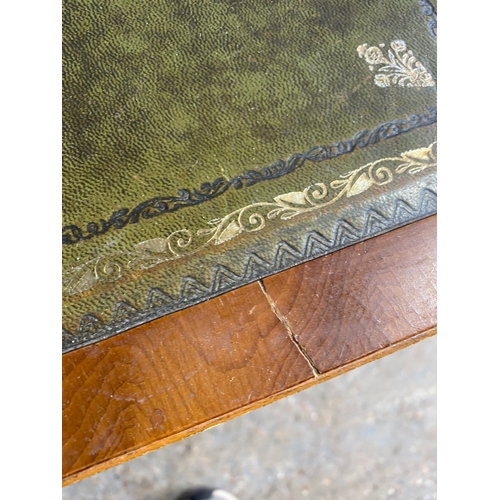 589 - Two retro inlaid green leather drop leaf side tables. 

Please see images for all dimensions.