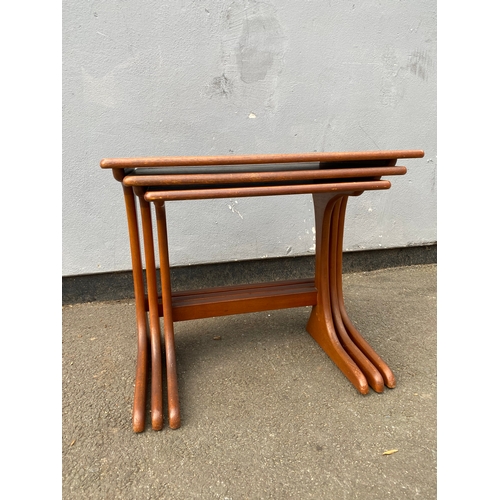 597 - G-Plan Teak nest of three tables. 

Dimensions of largest for reference - 22