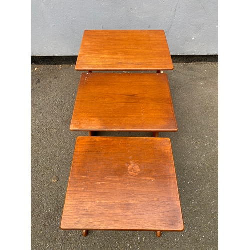 597 - G-Plan Teak nest of three tables. 

Dimensions of largest for reference - 22