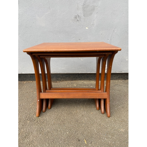 597 - G-Plan Teak nest of three tables. 

Dimensions of largest for reference - 22