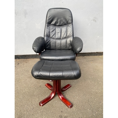 598 - Black leather swivel arm chair and footstool 

Please see images for dimensions.