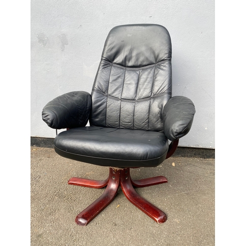 598 - Black leather swivel arm chair and footstool 

Please see images for dimensions.