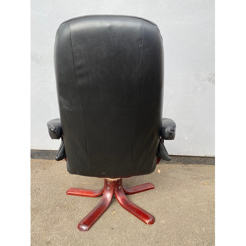 598 - Black leather swivel arm chair and footstool 

Please see images for dimensions.