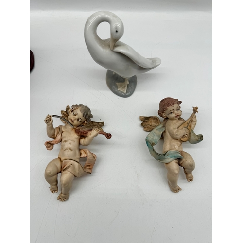 284 - Carved wooden bird, two cherubs, Lladro duck