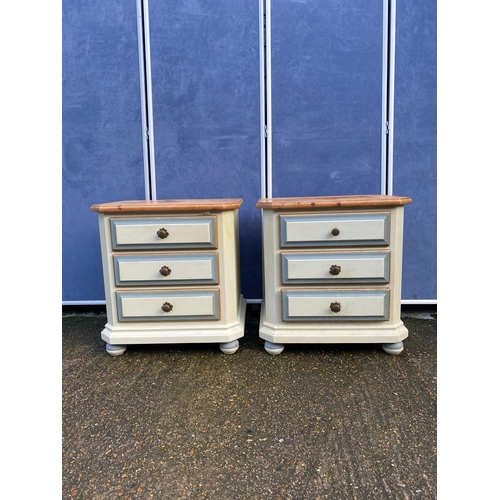 A pair of painted pine three drawer bedside tables. 

Dimensions - 23.5" x 18" x 24.5" approx