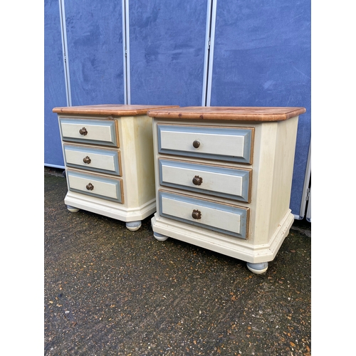 301 - A pair of painted pine three drawer bedside tables. 

Dimensions - 23.5