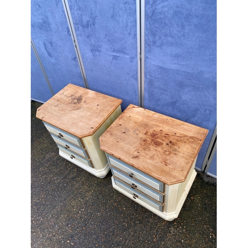 301 - A pair of painted pine three drawer bedside tables. 

Dimensions - 23.5