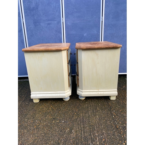 301 - A pair of painted pine three drawer bedside tables. 

Dimensions - 23.5