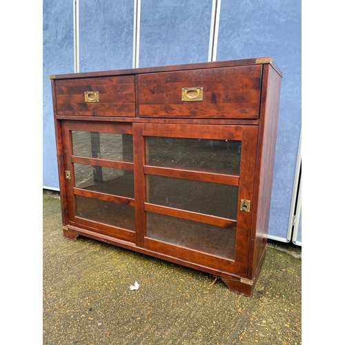 306 - Campaign style bookcase with two drawers. 

Dimensions - 47.5