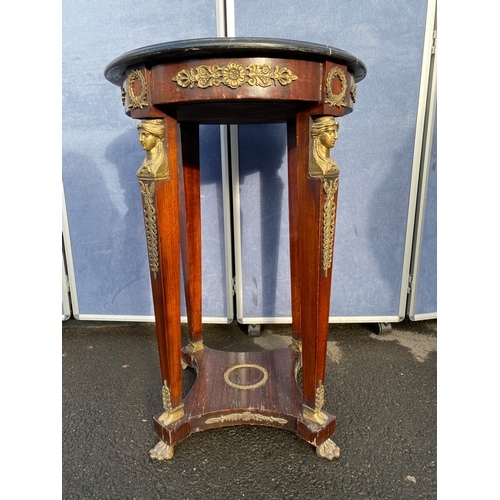 339 - A pair of French Empire Style hardwood and ormolu mounted circular tables, the black moulded marble ... 