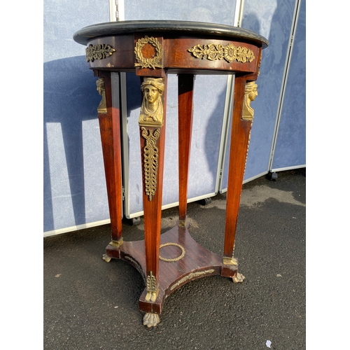 339 - A pair of French Empire Style hardwood and ormolu mounted circular tables, the black moulded marble ... 