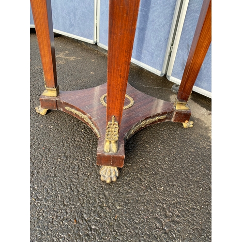 339 - A pair of French Empire Style hardwood and ormolu mounted circular tables, the black moulded marble ... 