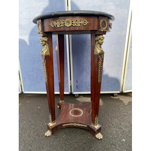 339 - A pair of French Empire Style hardwood and ormolu mounted circular tables, the black moulded marble ... 