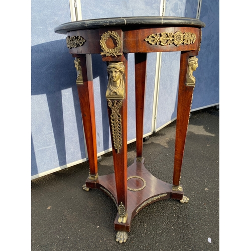 339 - A pair of French Empire Style hardwood and ormolu mounted circular tables, the black moulded marble ... 