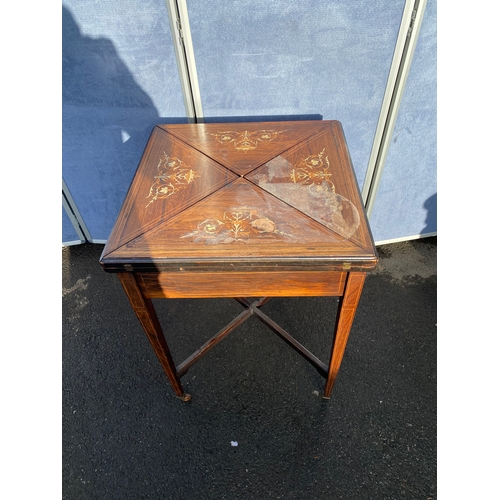 340 - 19th century Rosewood and strung envelope card table with h9inged moulded edge top with scrolling fo... 