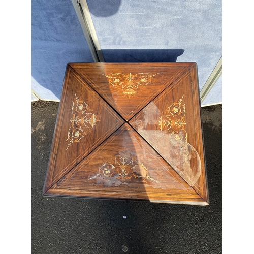 340 - 19th century Rosewood and strung envelope card table with h9inged moulded edge top with scrolling fo... 