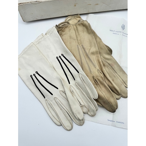 16 - Two pairs of vintage driving gloves in case