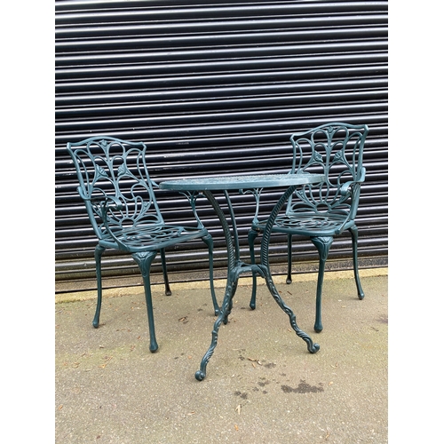 368 - Vintage cast garden table and chairs in green. 

Please see images for dimensions.