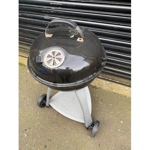 372 - BBQ grill with temperature gauge.