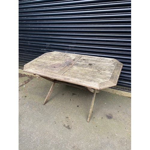 377 - Teak garden table. 

Dimensions - 60