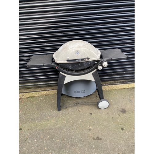 378 - Weber Q gas BBQ grill with side tables.