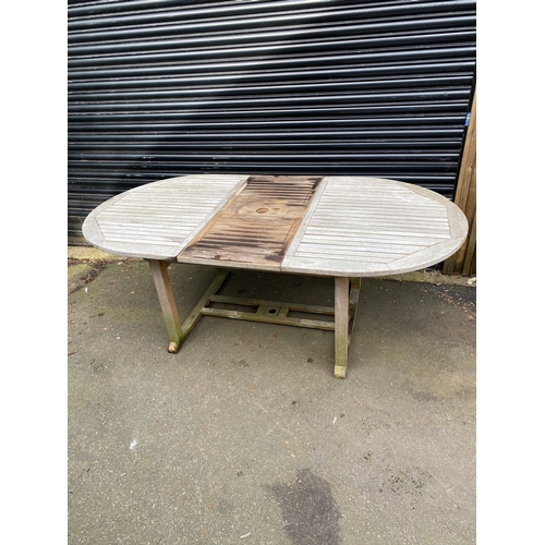 380 - Extendable teak oval garden table. 

Please see images for dimensions.