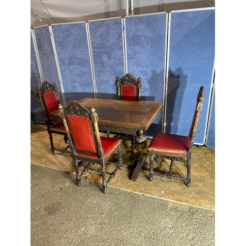 388 - Antique Oak extendable dining table and a set of four Oak carved chairs. 

Dimensions - 18.5