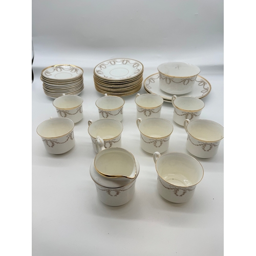 48 - 37 Piece Antique Gilded S&N L Paix Porcelain Tea Service