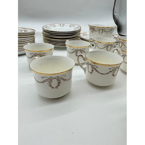 48 - 37 Piece Antique Gilded S&N L Paix Porcelain Tea Service