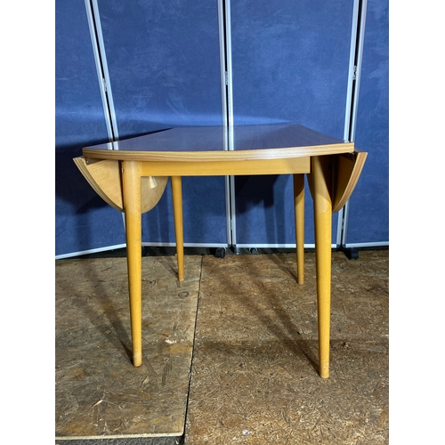 410 - Mid century drop leaf table and three chairs. 

Please see images for all dimensions.