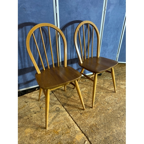 411 - A pair of Ercol chairs. 

Dimensions - 15.5