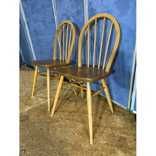 411 - A pair of Ercol chairs. 

Dimensions - 15.5