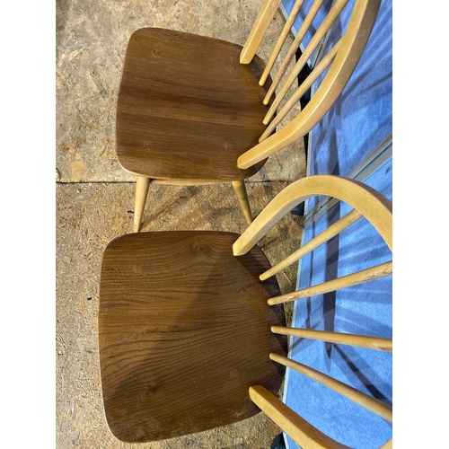 411 - A pair of Ercol chairs. 

Dimensions - 15.5