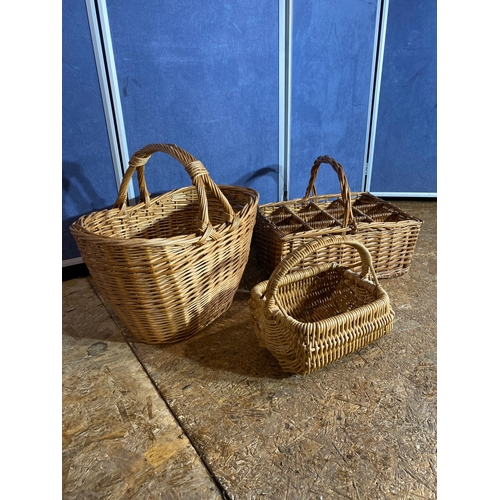 413 - Three wicker baskets. 

Please see images for dimensions of largest for reference.