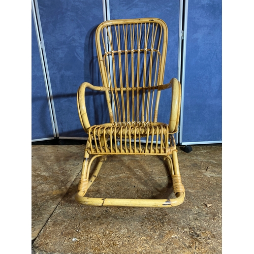 414 - Wicker/Cane rocking chair. 

Dimensions - 22