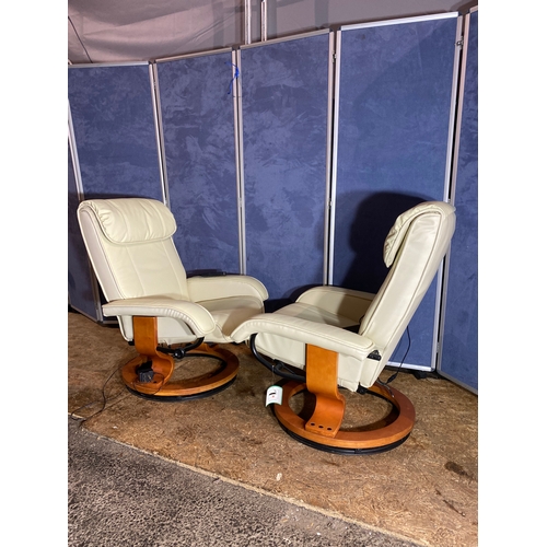 415 - A pair of leather recliner massage chairs and foot stools. 

Dimensions - 32